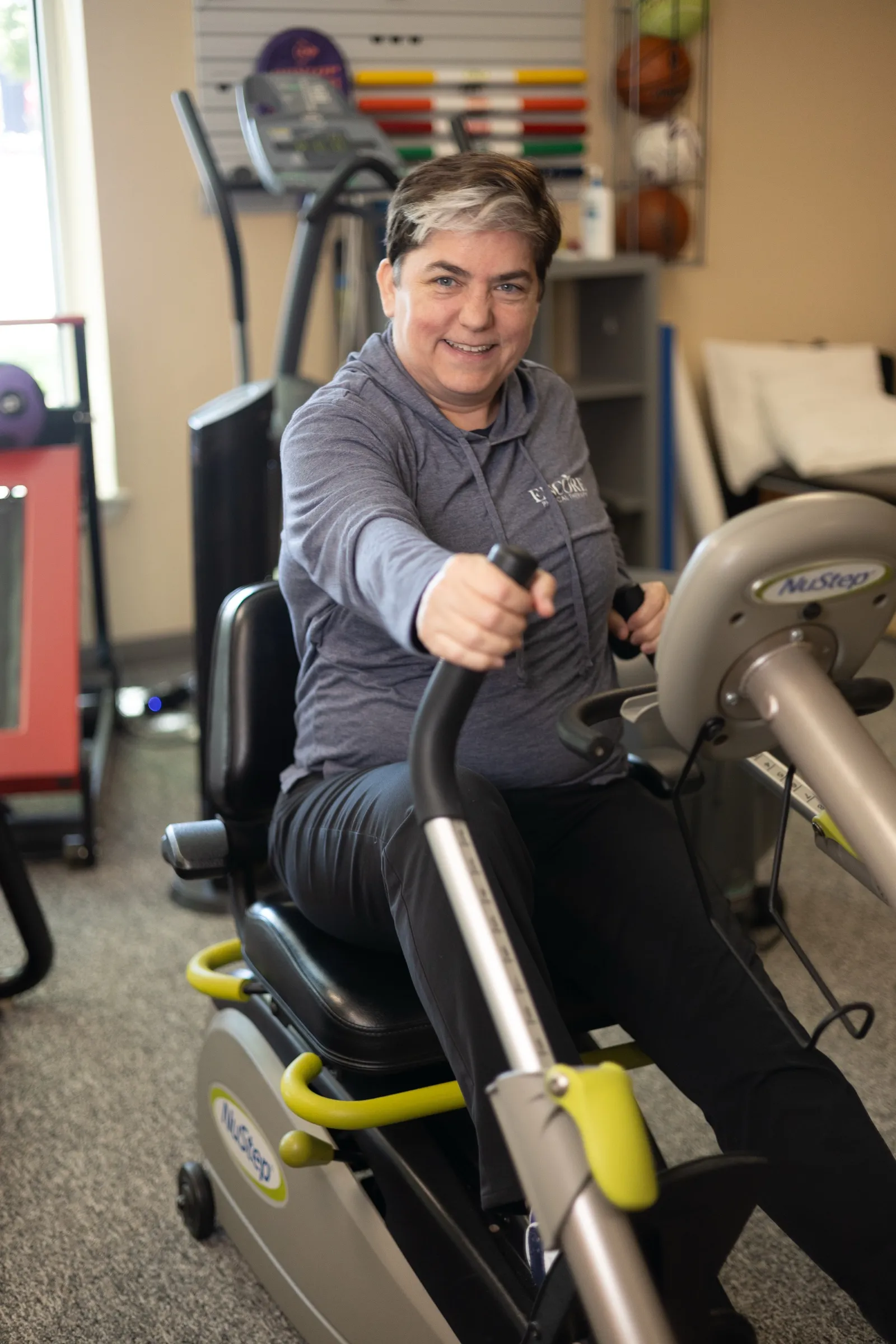 Exercise on a recumbent cross-trainer at Encore