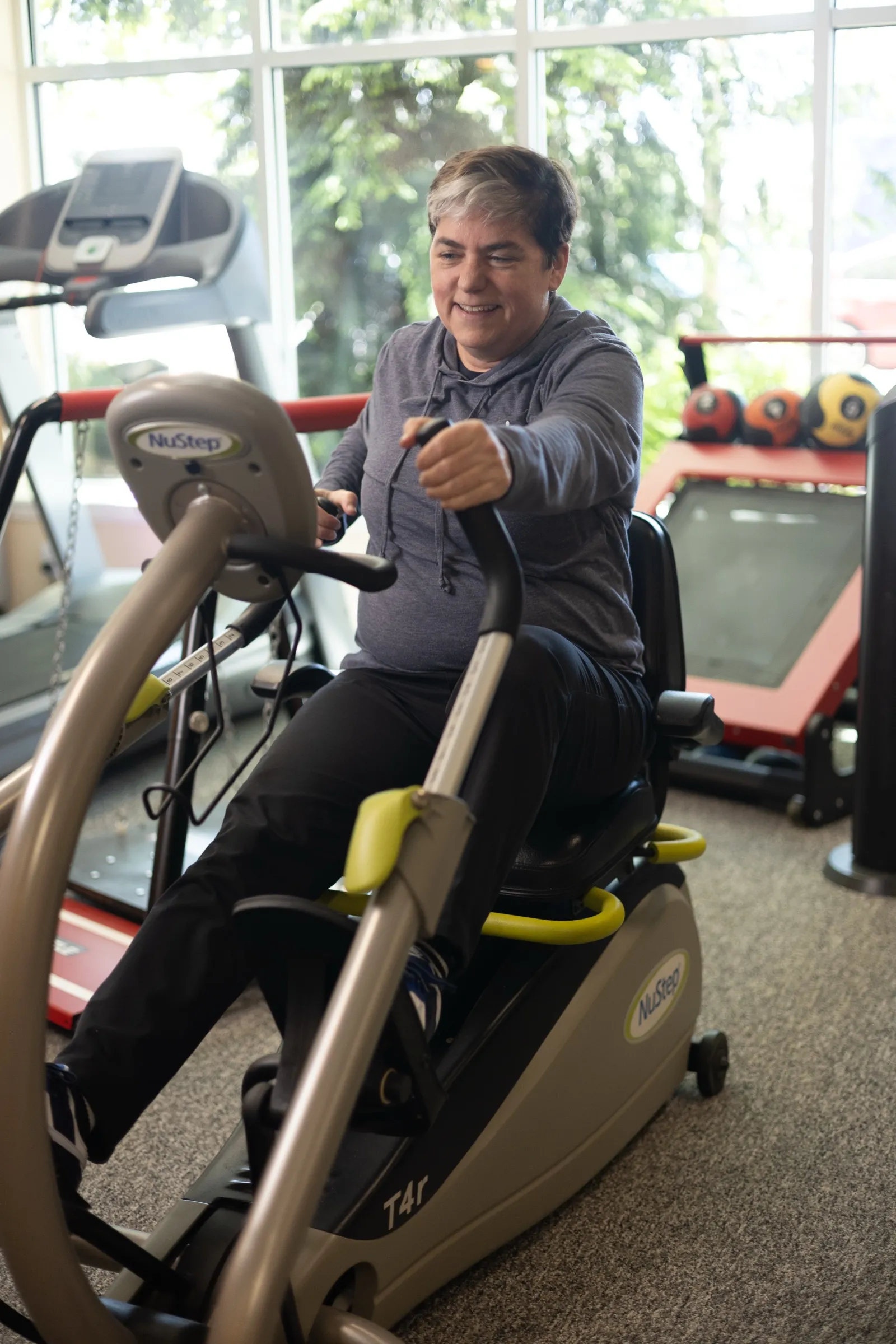 Exercise on a recumbent cross-trainer at Encore